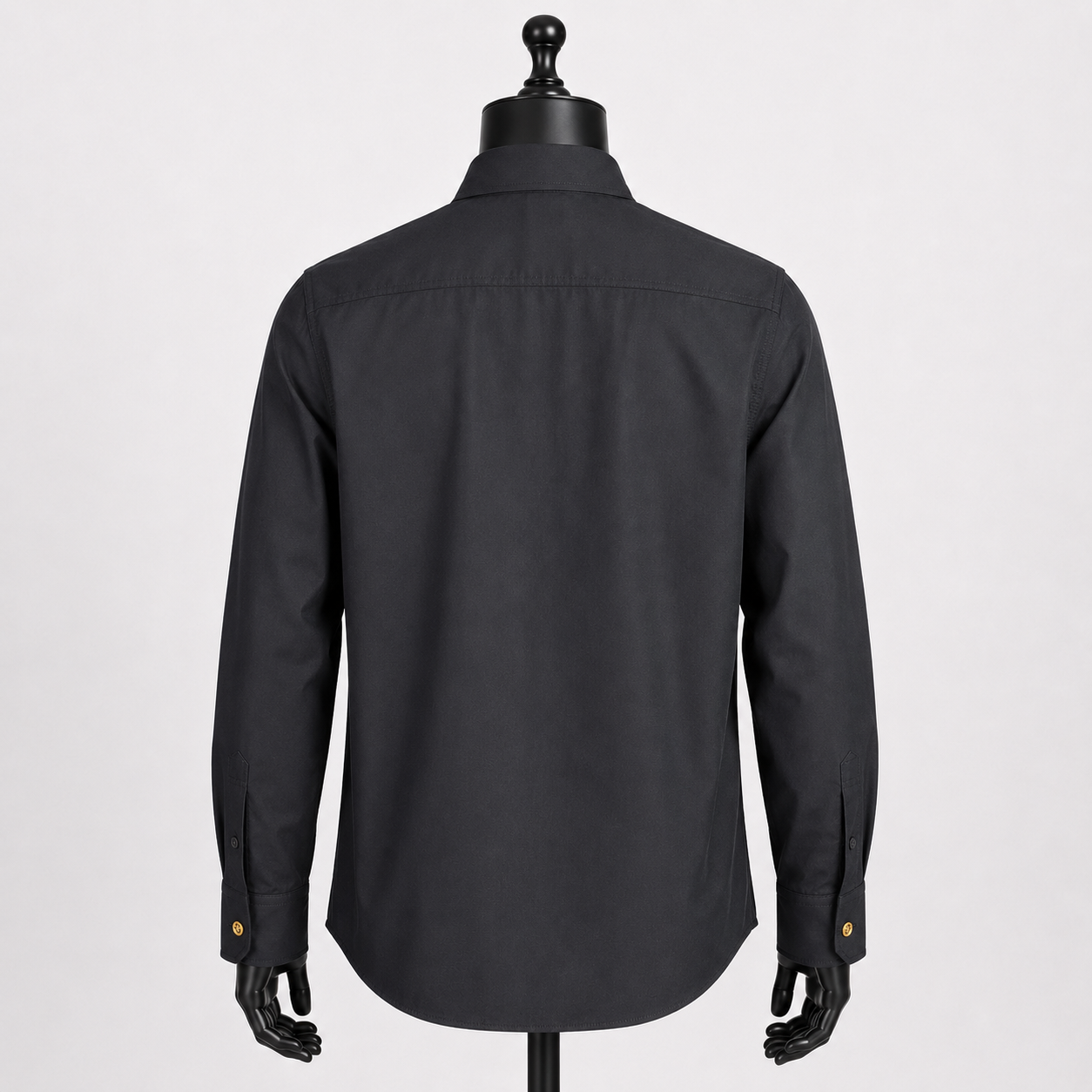 Loved By Lea: Versace Tribute Collection black poplin cotton shirt back view on mannequin showing clean structured silhouette and gold Medusa cuff buttons