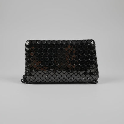 Black beaded clutch bag on a white background