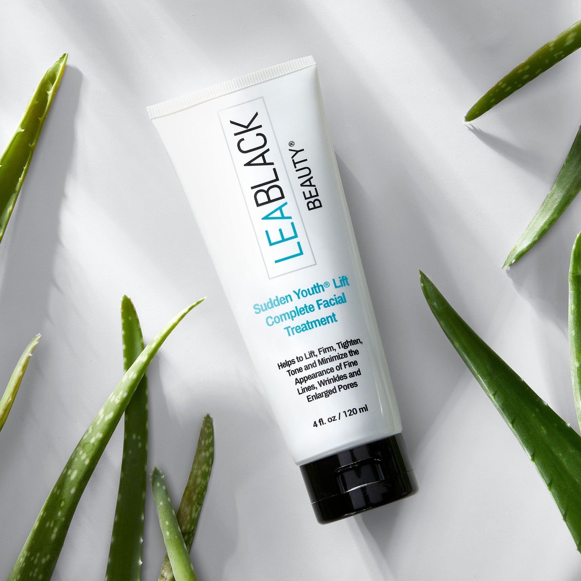 A container of Lea Black Beauty® Sudden Youth® Lift Complete Facial Treatment surrounded by aloe plants