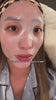 Chloe relaxing in pajamas while wearing the PrimaCure E-50 Pink Caviar Salmon Exosome Face Mask.