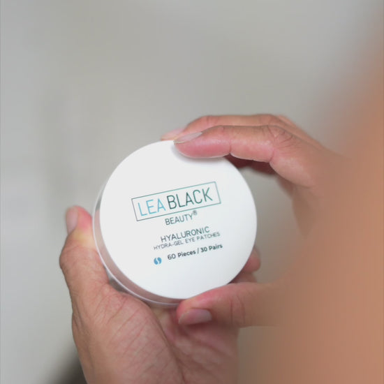Jordanny applying Lea Black Beauty Hyaluronic Hydra-Gel Eye Patches beneath his eyes for targeted hydration.