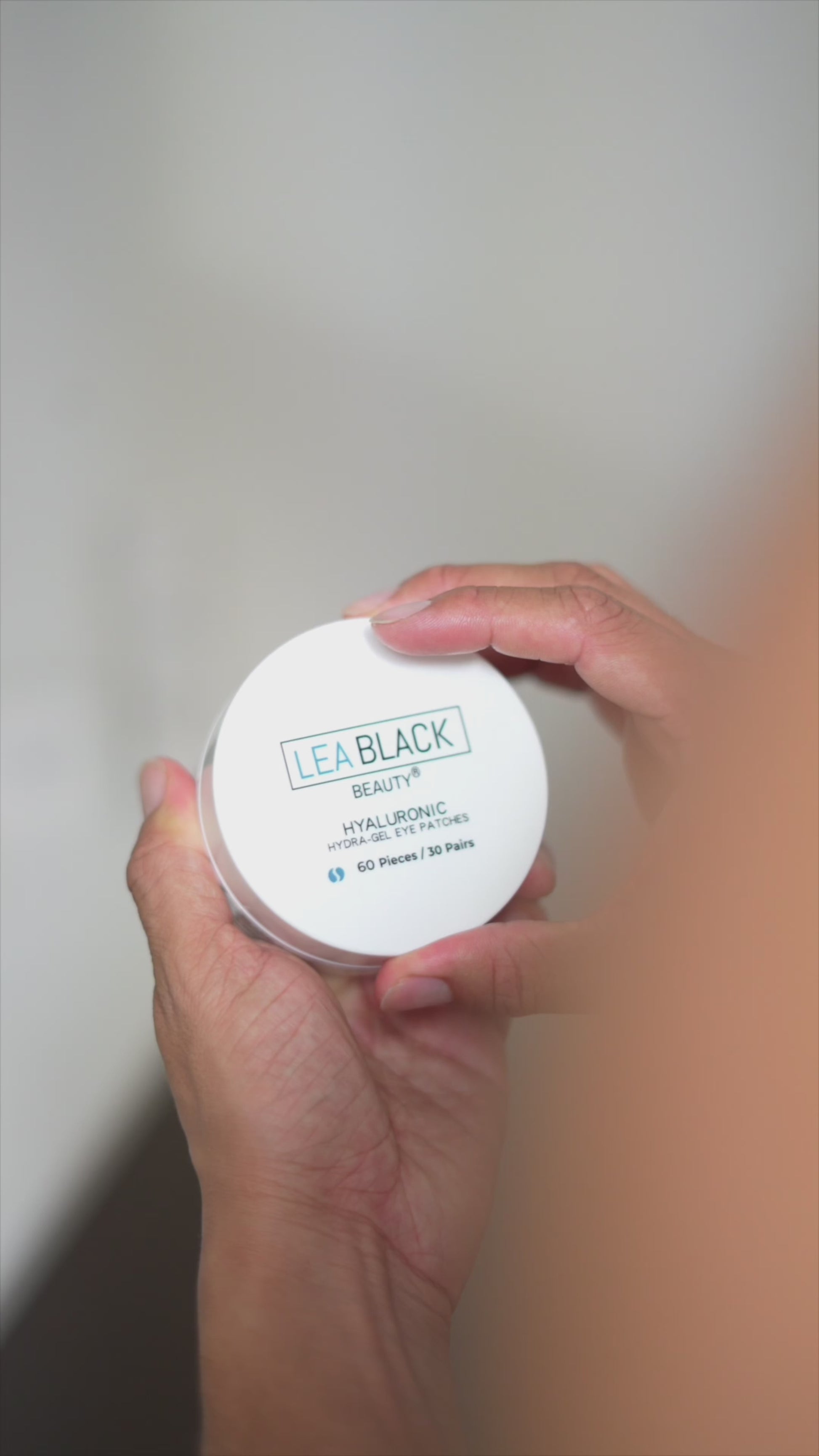 Jordanny applying Lea Black Beauty Hyaluronic Hydra-Gel Eye Patches beneath his eyes for targeted hydration.