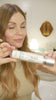 Leslie dispensing and applying Lea Black Beauty 150mg CBD Daily Face Moisturizer across her face.