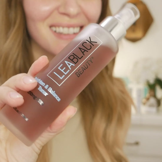 Leslie applying Lea Black Beauty Brighten and Balance 200mg CBD Skin Toner to her face with a cotton pad.