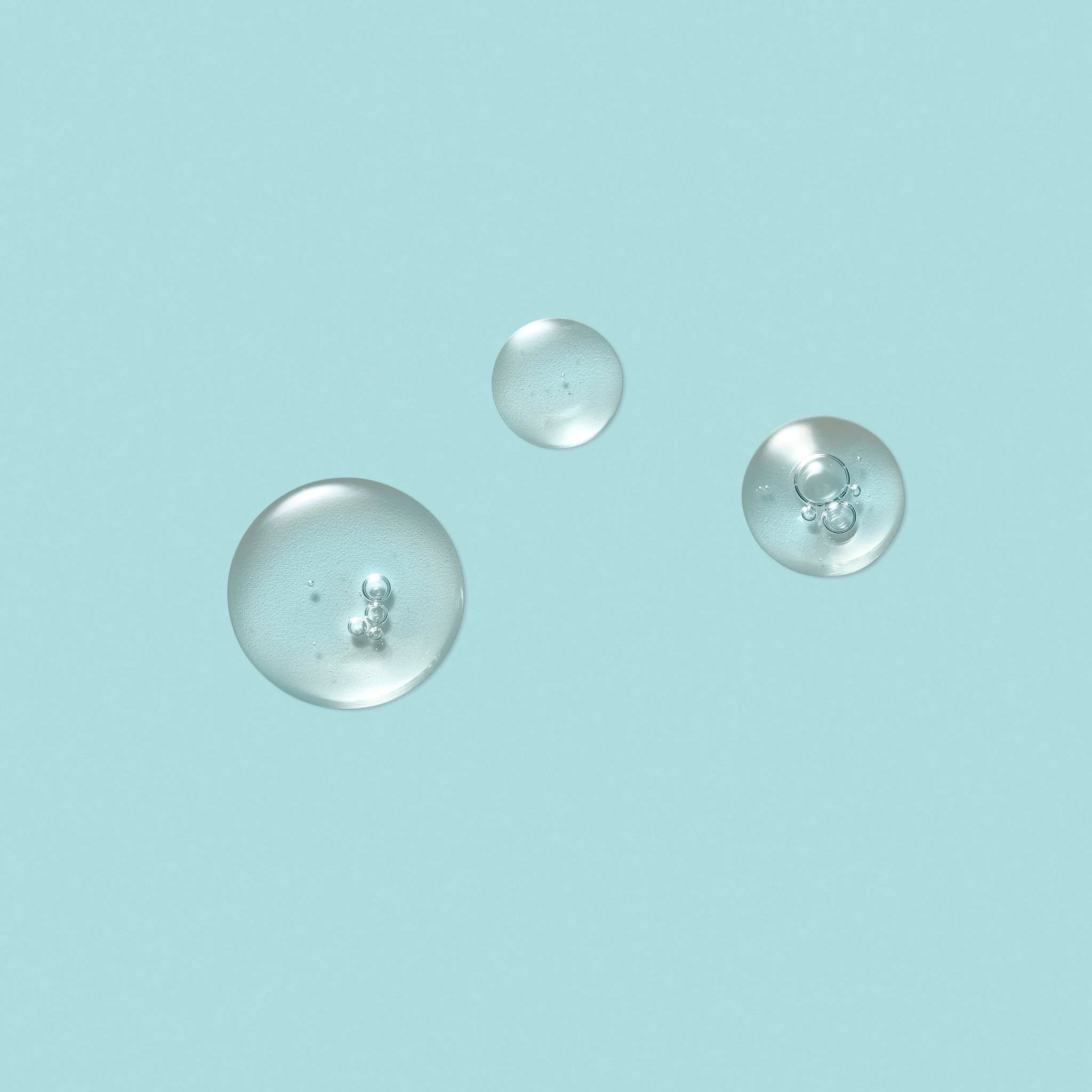 drops of serum on a blue background
